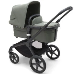 Bugaboo Fox 5 Complete Pushchair Bundle - Black/Forest Green Complete -Baby Products Series LargeJPG 100051041 fox5 complete black bassinet forest green sideshot 4548c35c c6d2 4a12 9bc7 b6b36c94e0f6
