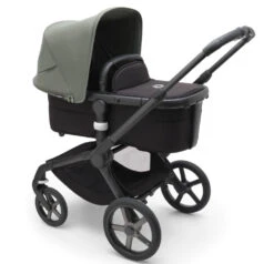 Bugaboo Fox 5 Travel System - Black/Midnight Black Base With Sun Canopy 27 Bugaboo Fox 5 Travel System - Black/Midnight Black Base With Sun Canopy -Baby Products Series LargeJPG 100167010 fox5 black bassinet black forest green sideshot ddec4cc6 a9c0 4a11 87b3 54e372204cd0
