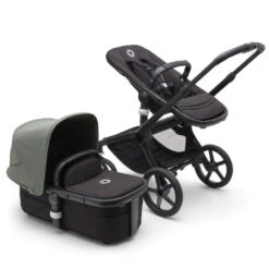 Bugaboo Fox 5 Travel System - Black/Midnight Black Base With Sun Canopy 29 Bugaboo Fox 5 Travel System - Black/Midnight Black Base With Sun Canopy -Baby Products Series LargeJPG 100167010 fox5 black black forest green combi 2 ea39c202 0770 437f 9b5e 69750f0c1076