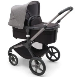 Bugaboo Fox 5 Travel System - Graphite/Midnight Black Base With Sun Canopy -Baby Products Series LargeJPG 100167012 fox5 gra bassinet black grey melange sideshot 69c55313 fd70 481c ab5e 87ca6d0a8cd7